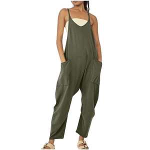 Detail of army green baggy overalls with large side pockets and loose wide-leg cut