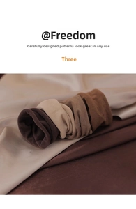 Close-up of four soft high-elastic seamless hair ties in earthy brown and beige tones