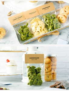 Detail of kraft paper header cards and clear bags for festive Christmas cookie packaging