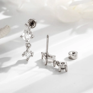 Silver rhombic kite zircon double-ended screw stud earrings shown in detail on white surface