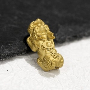 Macro shot of 18K gold plated stainless steel Pixiu charm with matte finish for bracelets
