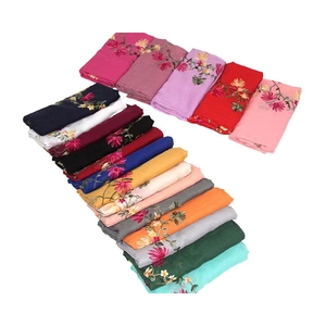 Lightweight ethnic shawls with floral embroidery in multiple colors on white background