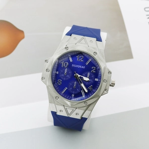 Macro detail of men's quartz watch with blue dial and geometric silver bezel