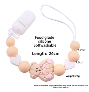 Detailed view of pink silicone bear pacifier clip with 24cm length and 22g weight specs