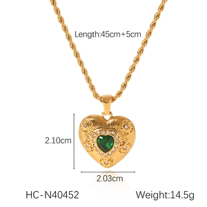Detail of 18K gold heart pendant necklace with green zircon and dimension specs