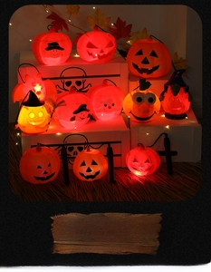 Collection of LED jack-o'-lantern pumpkins with wizard hats and warm glowing lights
