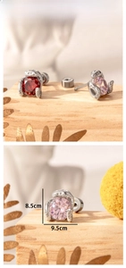 Detailed size display of oversized snake-shaped titanium steel ear studs with red zircon