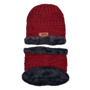 Detail of burgundy knitted hat and neck gaiter set with warm artificial fur lining