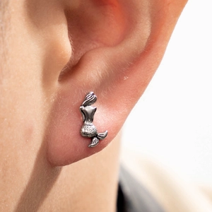 Silver stainless steel mermaid stud earring shown on model with minimalist style
