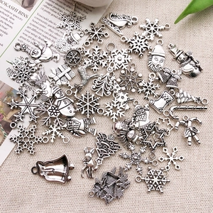 Vintage silver Christmas alloy pendants featuring Santa, snowflakes, and elk for DIY jewelry