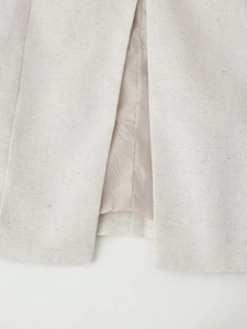 Women's beige linen vest top with round neck and single-breasted detail for summer 2025