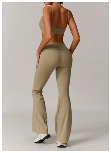 Detail view of khaki ribbed yoga set featuring thin strap top and high-waist flared leggings