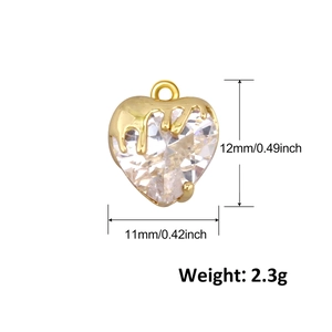 Detail showing dimensions and weight of a gold heart pendant with faceted clear stone