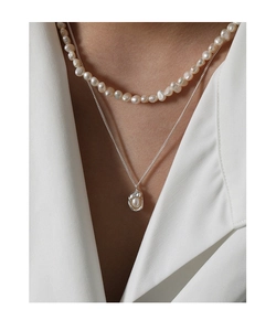 Close-up of double-layered S925 silver necklace with white pearls and baroque pendant