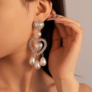 Elegant silver heart earrings with sparkling zircons and teardrop pearl pendants