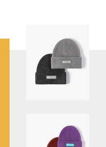 Detailed view of the vertical ribbed knit texture and New York patch on the beanie