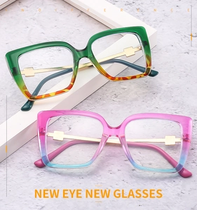 Close-up of stylish oversized cat-eye glasses frames with golden cross metal hinges