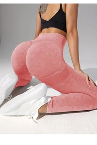 Detailed view of high waist scrunch butt yoga leggings in rose pink seamless knit
