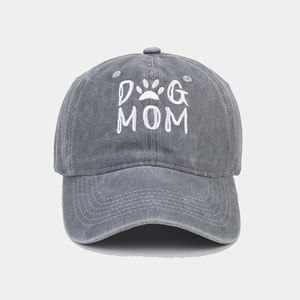 Detail of Dog Mom white embroidery and paw print on grey washed cotton baseball cap