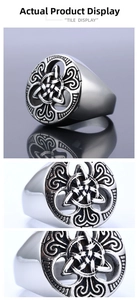 Macro view showing intricate triquetra knot and hollow carving on stainless steel ring