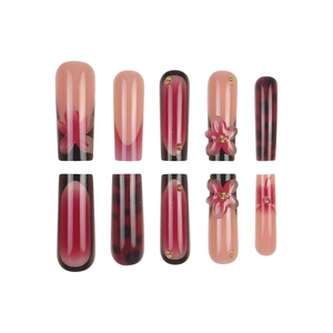 Long trapezoid press-on nails set with red marble patterns and 3D floral accents
