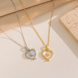 Minimalist titanium steel heart pendant necklaces in gold and silver finish on stone