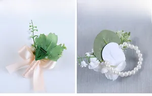 Detailed back view of white floral boutonniere with pin and pearl elastic wrist corsage