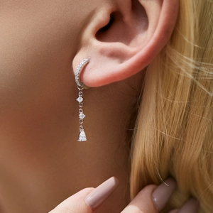 S925 sterling silver drop earrings with long tassels and sparkling crystals on model