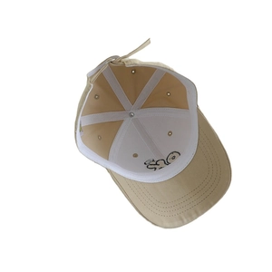 Beige kids baseball cap showing inner lining structure and cartoon embroidery on brim