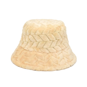 Close-up of beige plush bucket hat showing thick faux fur texture and woven pattern detail