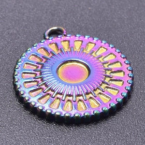 Macro shot of 18k gold plated rainbow pendant with sunburst pattern and gear edge detail