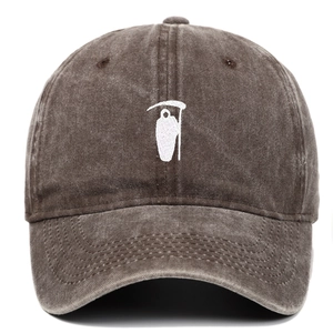 Detailed embroidery of a white Grim Reaper on a vintage washed coffee baseball cap