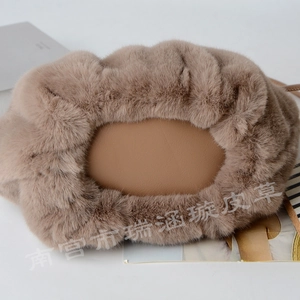 Close-up detail of khaki faux rabbit fur bucket bag featuring a smooth synthetic leather base