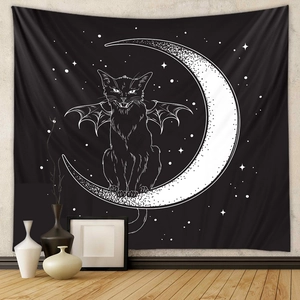 Detail showing a cat with bat wings on a crescent moon fabric wall tapestry