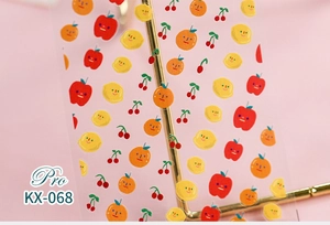 Detailed macro view of 5D fruit nail stickers with cute expressions on pink background