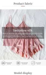 Detail of pink satin camisole set with delicate straps and ruffled hem shorts