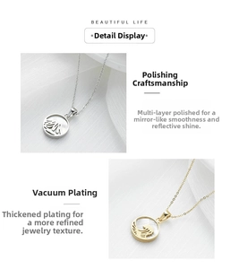 Polished stainless steel round pendant with wave cutout design and mother of pearl inlay