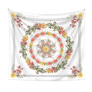 Detailed flat lay of watercolor floral mandala tapestry with pink and yellow flower patterns