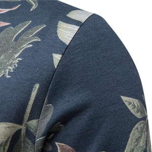 Men's navy polo shirt with tropical leaf print and premium shoulder stitching detail