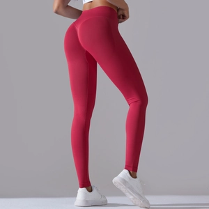 Detail view of red seamless high waist yoga leggings with peach butt lift contouring