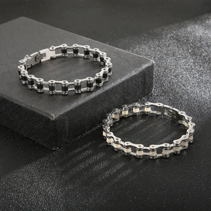 Detail of hiphop bicycle chain bracelets in silver with black and ivory inner core links