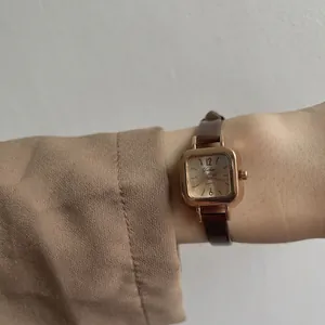 Minimalist square watch for women with rose gold case and slim dark brown leather strap