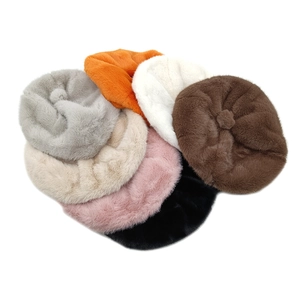 Detailed overhead view of plush beret collection in seven stylish assorted colors