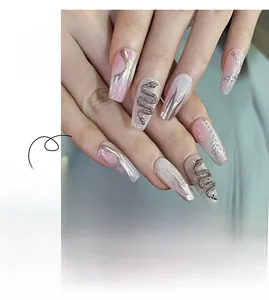 Detail of pink gradient press-on nails with 3D silver snake and flame chain design