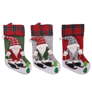 Set of 3 3D Gnome Christmas stockings with red and black plaid cuffs and skiing ornaments