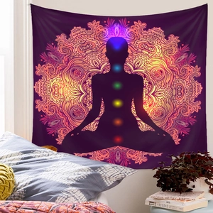Detailed view of meditation chakra tapestry hanging above bed in cozy bedroom decor