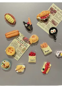 Detailed view of realistic 3D food fridge magnets like croissants and lobster
