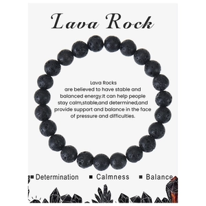Detailed close-up of 8mm black lava stone beads on a white card showing matte texture