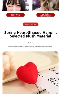 Close-up detail of a red plush heart hair clip with flexible spring and black metal clip