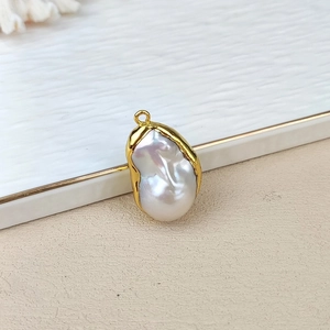 Macro detail of baroque freshwater pearl with gold-plated edge for DIY jewelry making